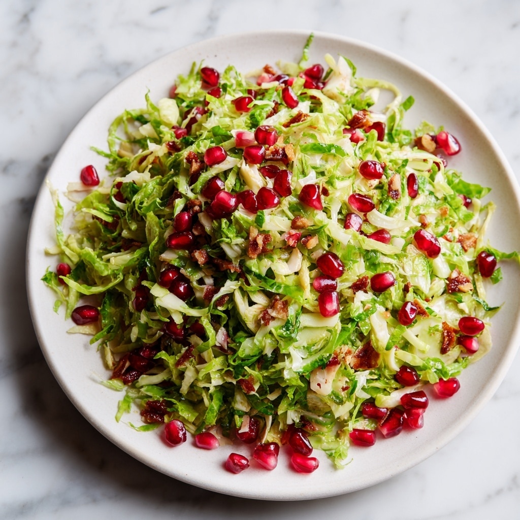 Christmas Salad with Brussels Sprouts, Kale, Pomegranate, and Citrus Vinaigrette Recipe