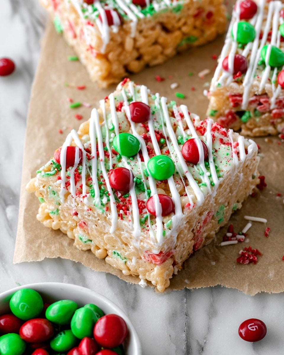 The image shows several square treats neatly cut and arranged close together on a white marbled texture. Each treat has a textured, light golden base made of crunchy rice cereal. The top layer is decorated with colorful red and green candy-coated chocolates scattered throughout, along with small red and green sprinkle bits. A thick drizzle of smooth, white icing is spread across each square in diagonal lines, covering candies and the surface evenly. The sides reveal soft, sticky layers holding the treats together, showing a mix of cereal and candy close to the edges. Photo taken with an iphone --ar 4:5 --v 7