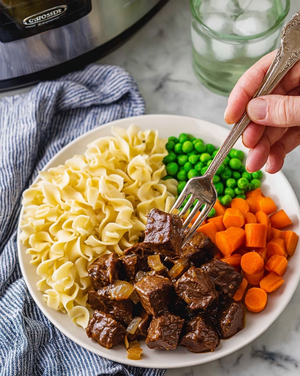 The image shows a slow cooker filled with chunks of cooked beef in a thick brown sauce. The beef pieces are irregular in shape, browned on the edges, and rest evenly throughout the dark interior of the slow cooker. The sauce looks glossy and rich, coating the beef with a smooth texture. Some pieces of cooked onion are mixed with the beef, adding a slight variation in tone with their soft brown color. The cooker is placed on a white marbled surface with a small part of a wooden texture visible at the edge. photo taken with an iphone --ar 4:5 --v 7